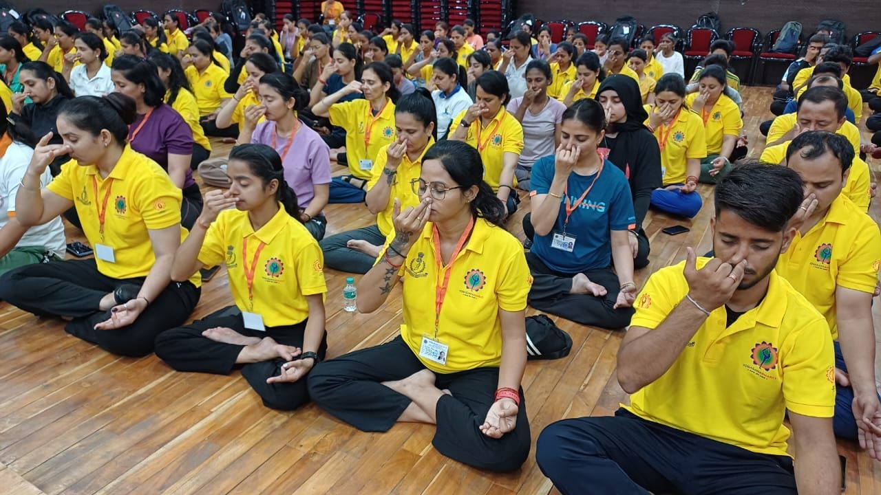 Students in prāṇāyāma during a school programme